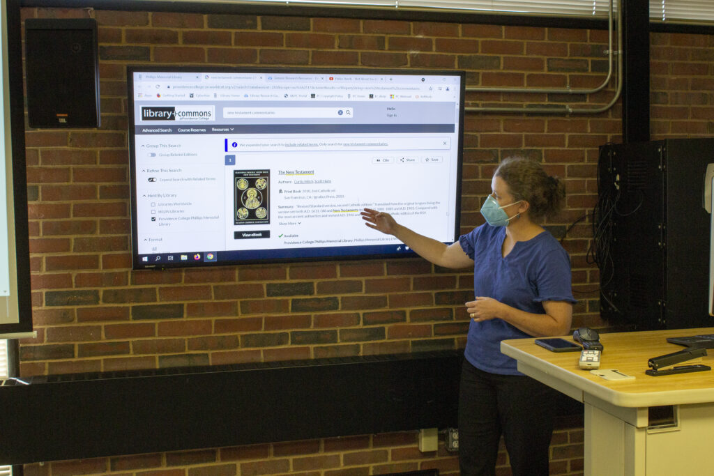 A research and education librarian teaching best practices for researching in the PC online catalog.