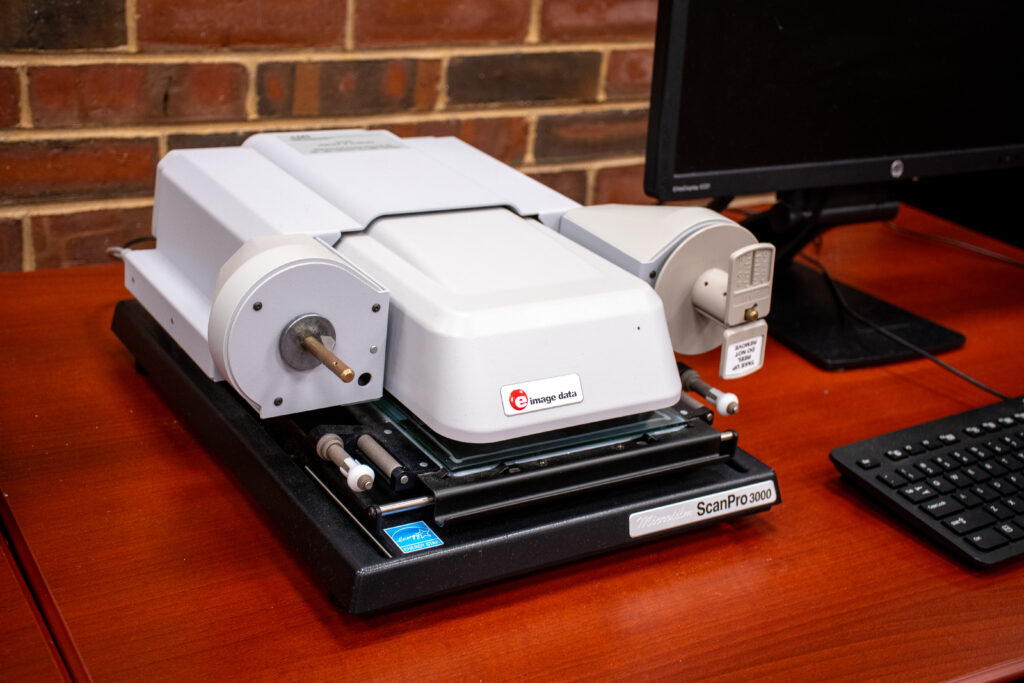 a microfilm reader with empty spool